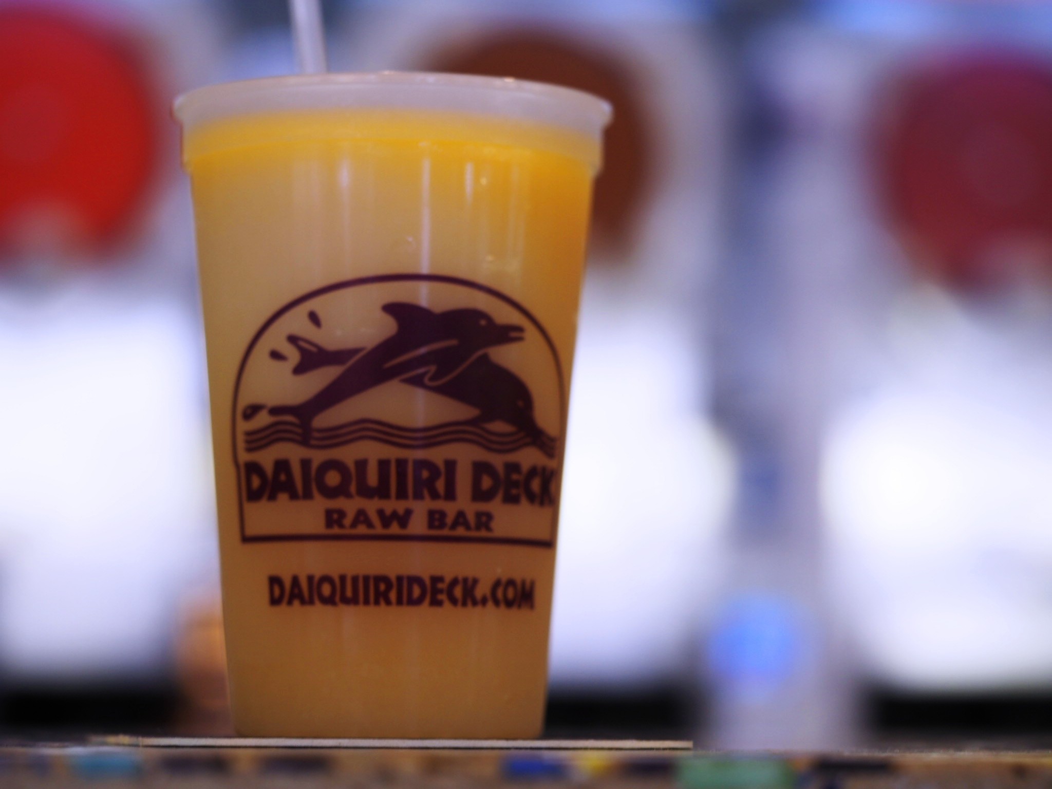A colorful daiquiri from Daiquiri Deck, a testament to Sarasota's vibrant frozen treat scene.